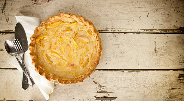 istock Peach Pie on Old White Wood Background 590303824