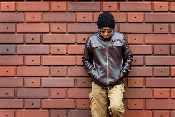 istock Asian Man in a Brown Jacket 590304616