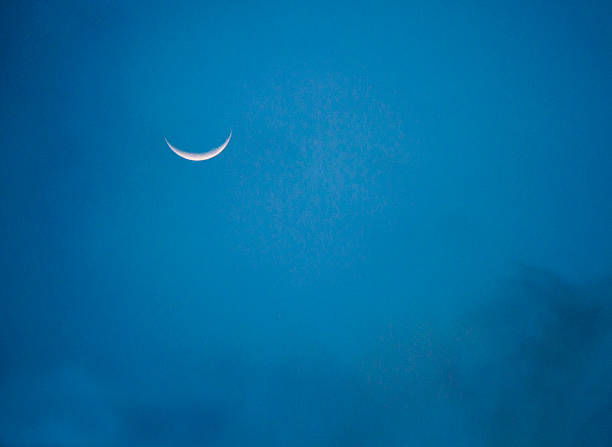 istock the last part of the moon,blue sky 590305472