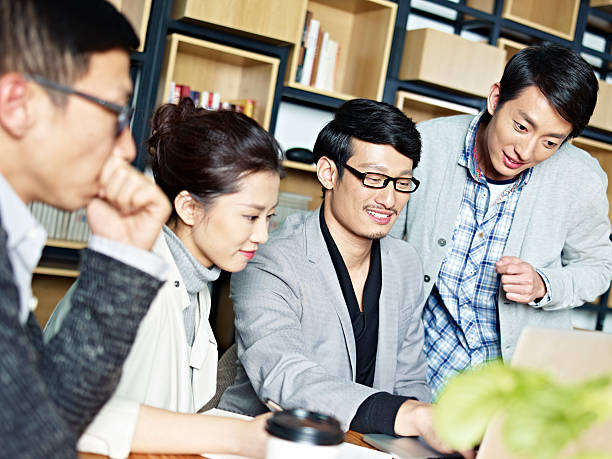 istock young asian business people working together in office 590581666