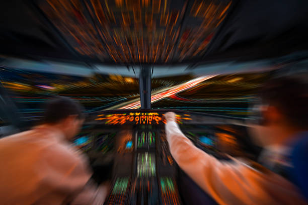 istock plane cockpit and city of night 590583138