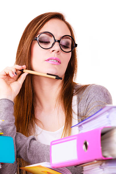 istock Woman sitting at desk in office and thinking 590583476