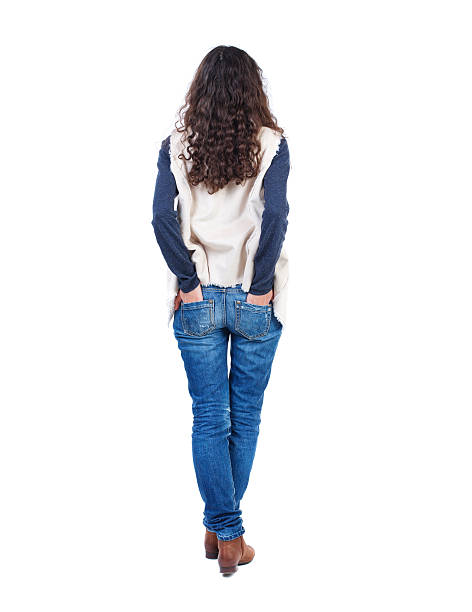 istock back view of standing young beautiful  woman 590585008