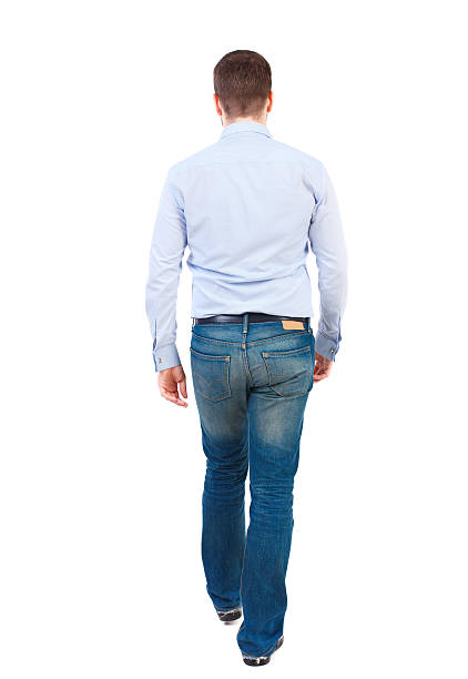 istock Back view of walking businessman. 590585232