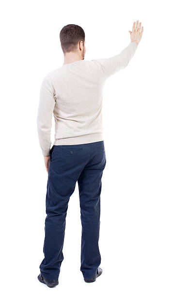 istock Back view of beautiful business man welcomes. 590585908