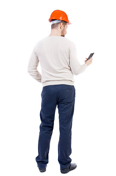 istock Backview of business man in construction helmet 590586000