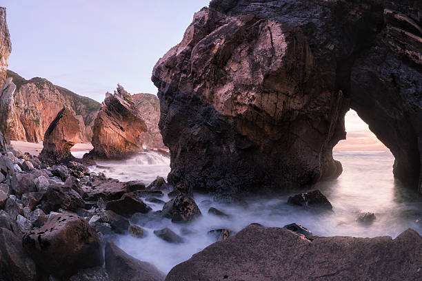 istock Twilight at rocky coastline of Atlantic ocean 590586180