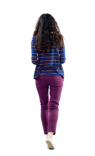 back view of walking  curly woman.  backside view of person.  Rear view people collection. Isolated over white background. Long-haired curly woman moves forward.