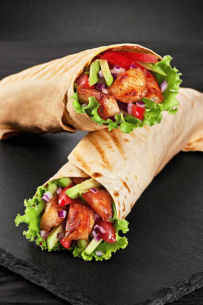 istock Burrito with grilled chicken and vegetables 590586538