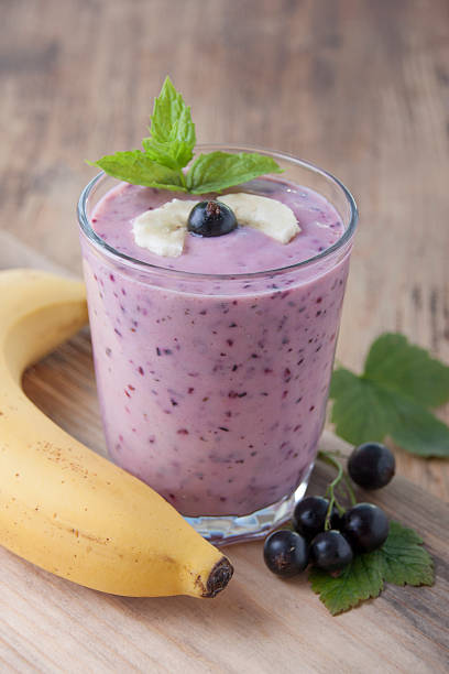 istock Smoothie of  banana and black currant   . 590589686