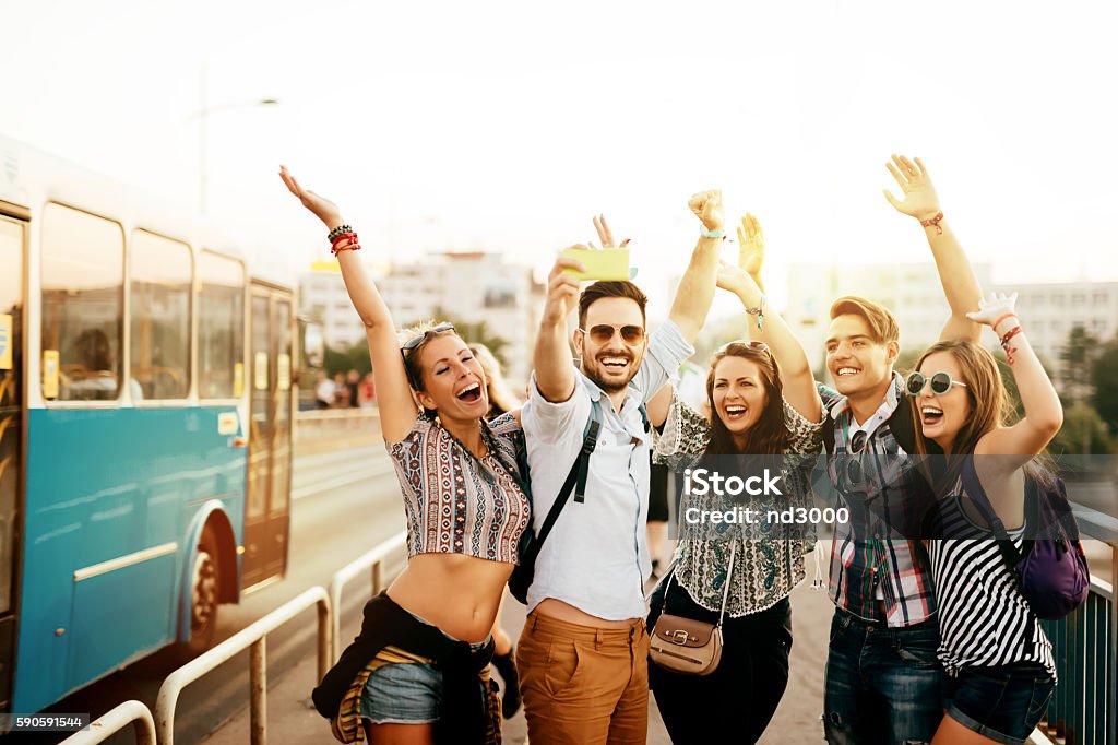 Friends travelling, taking selfies and smiling Cheerful friends travelling, taking selfies and smiling Adult Stock Photo