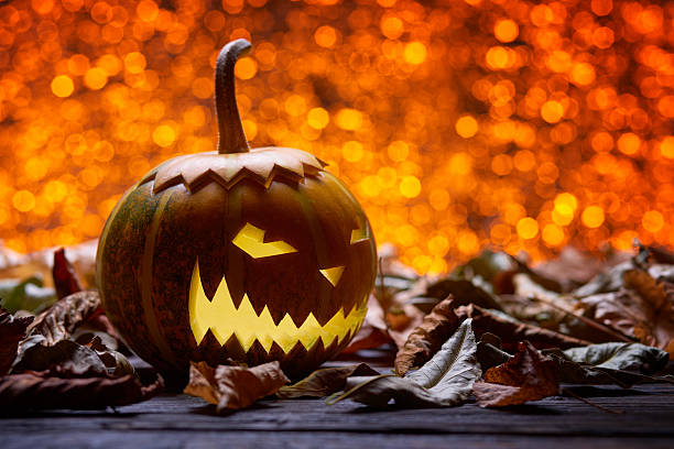 istock Pumpkin for Halloween dry leaves 590593074