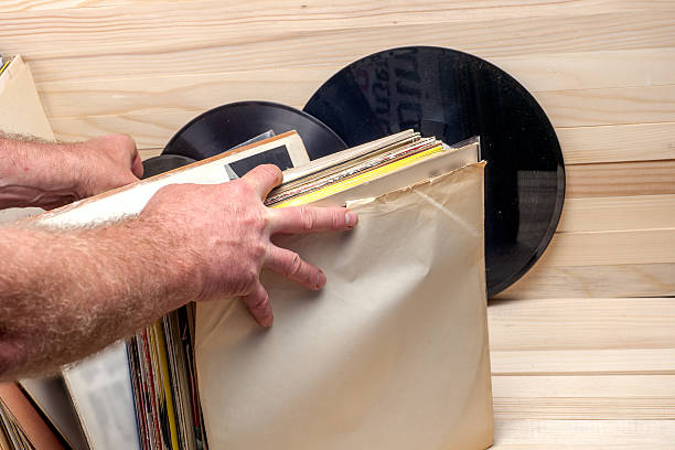 istock Browsing through vinyl records collection. Music background. Copy space 590593648
