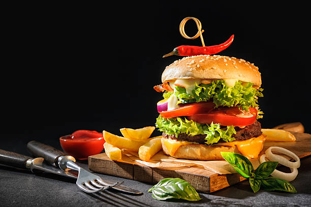 istock Delicious hamburger with French fries 590594984