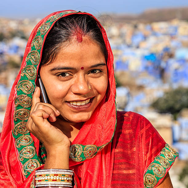 istock Young Indian woman using mobile phone, Jodhpur, India 590595544