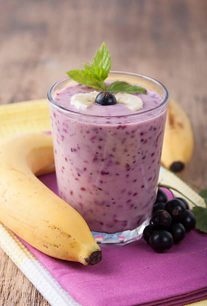 istock Smoothie of  banana and black currant   . 590601568