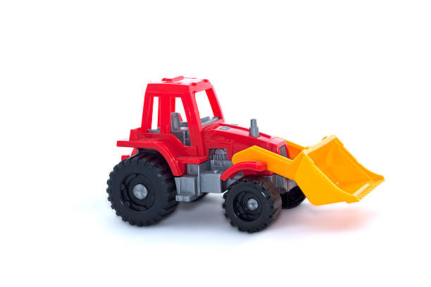 istock The toy tractor on a white background 590601910
