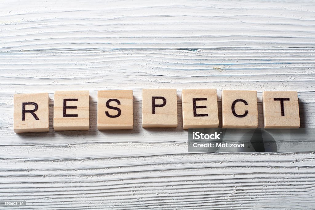 RESPECT word written on wood block ta wooden background RESPECT word written on wood block ta wooden background. Respect Stock Photo