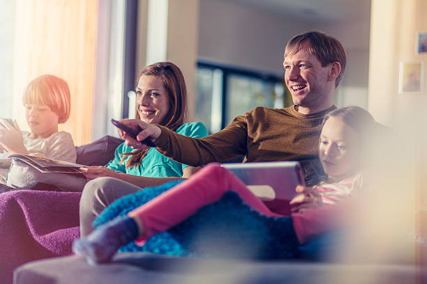 Family sitting on sofa