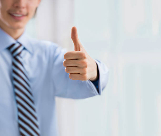 istock Business man hand closeup with thumb up 590604642
