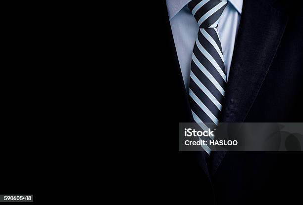 Black Business Suit With A Tie And Copyspace Background Stock Photo - Download Image Now