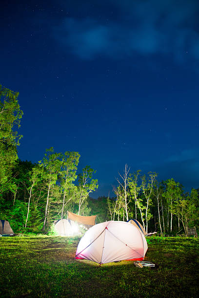 istock Camping tent under stars at night 590605912