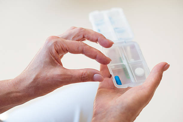 istock Hands holding little box with medicals 590607488