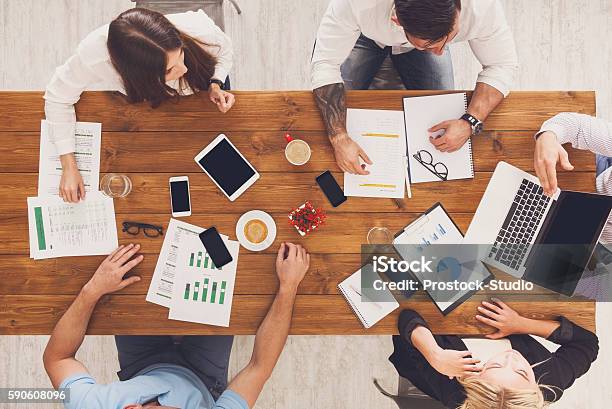 Group Of Busy Business People Working In Office Top View Stock Photo - Download Image Now