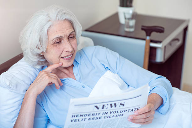 istock Old woman at hospital ward 590609848