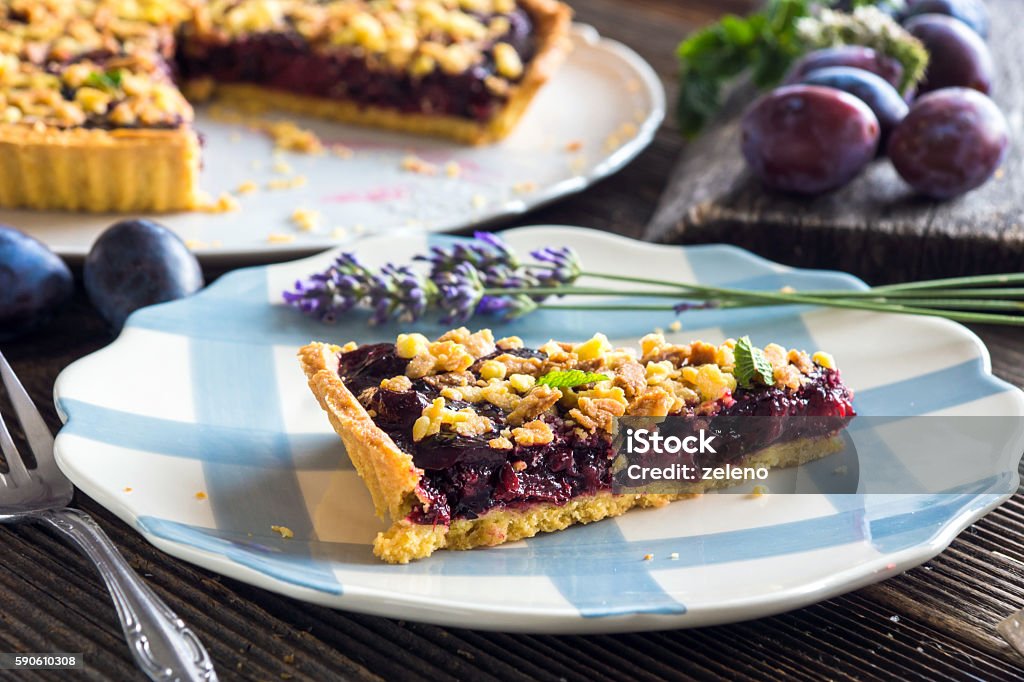 Homemade organic plum pie on wooden background Autumn Stock Photo