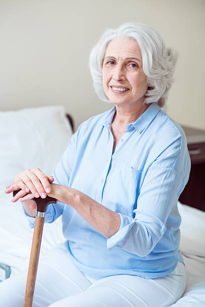 istock Positive senior woman sitting 590610850