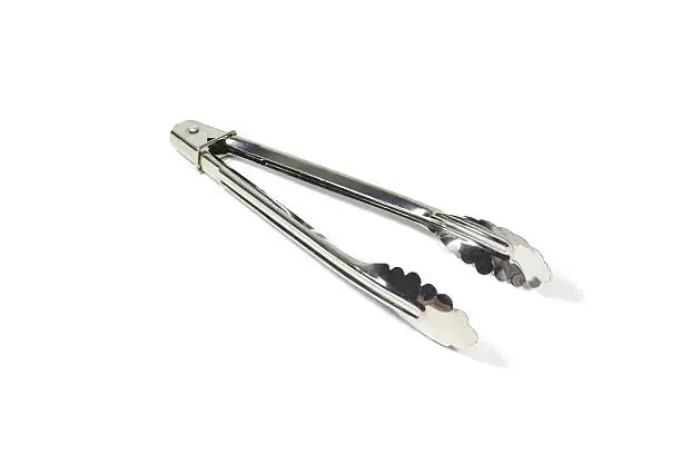Photo of kitchen tongs isolated on a white background with clipping path