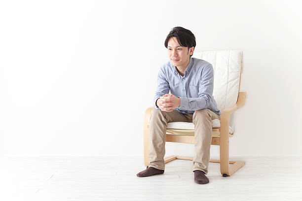 Japanese man relaxing in chair