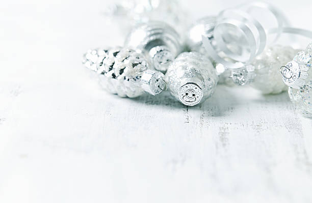 istock Christmas Ornaments on a white painted wooden background 590612760