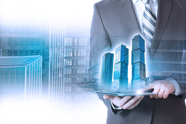 istock businessman holding a building, skyscraper 590615006