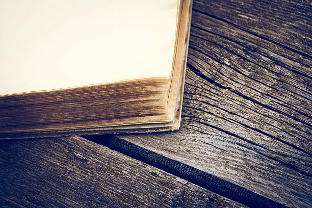 istock Old books on wooden table. 590615632
