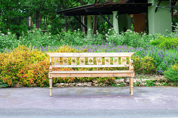 istock wooden park bench at a park 590615762