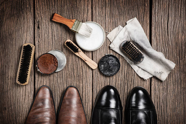 cleaning shoes leather boots with shoe maintenance set leather care stock pictures, royalty-free photos & images