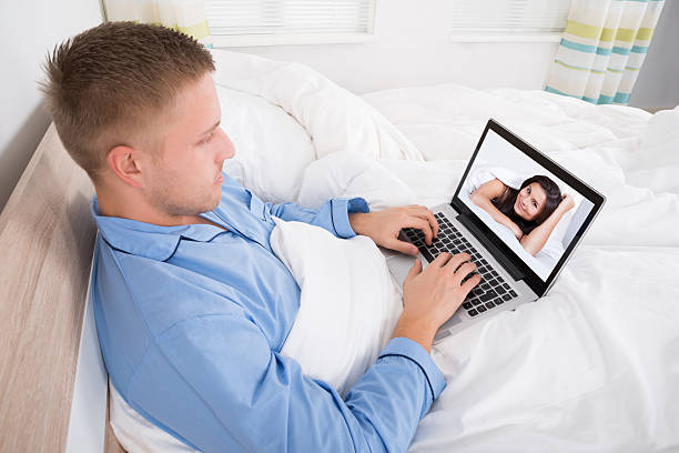 istock Man Video Chatting With Woman At Home 590616522