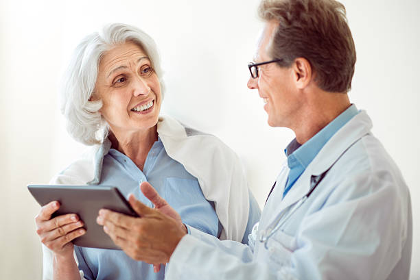 istock Senior patient and handsome doctor 590616710