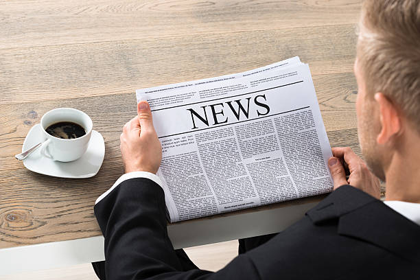 istock Businessman Reading Newspaper In Office 590617930