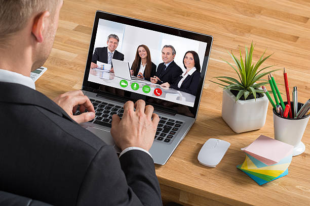 istock Businessman Video Conferencing On Laptop 590619434