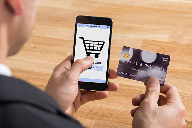 istock Businessman With Mobile Phone And Credit Card 590619554