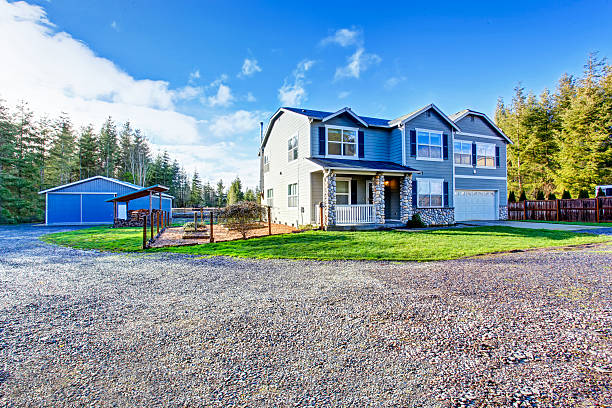 istock Two level blue country farm house with rocks trim 590619626