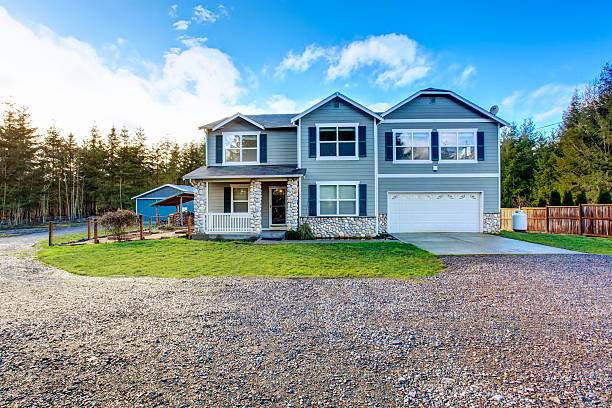 istock Two level blue country farm house with rocks trim 590619724