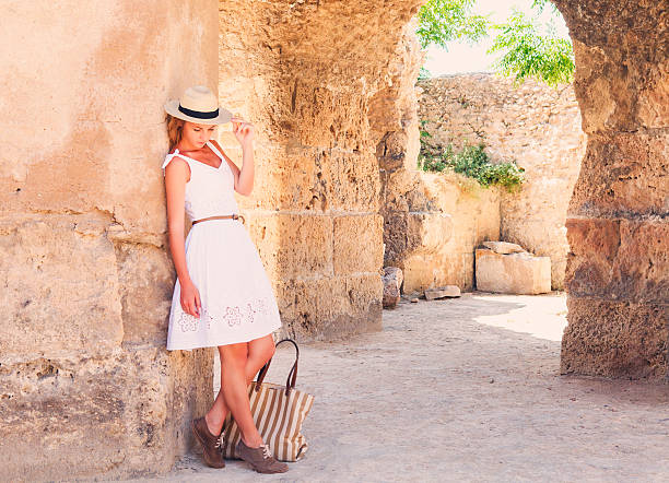 istock Woman traveler at ancient ruins Carthage 590619790