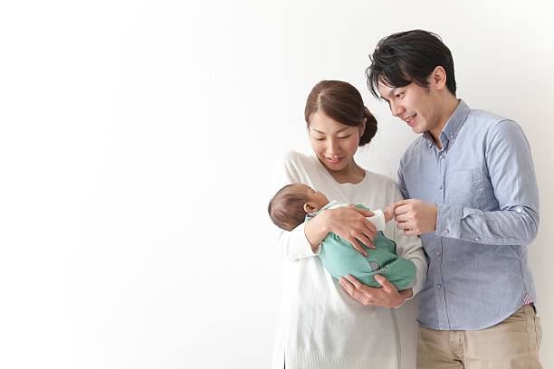 japanese couple with child - mother family baby isolated imagens e fotografias de stock