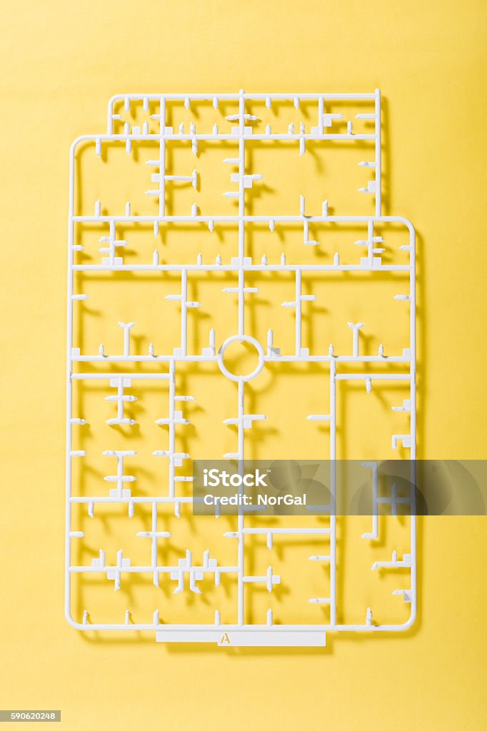 sprue sprue or injection moulding of toy on yellow background Model Kit Stock Photo