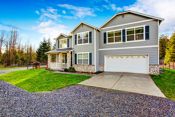 istock Two level blue country farm house with rocks trim 590620790