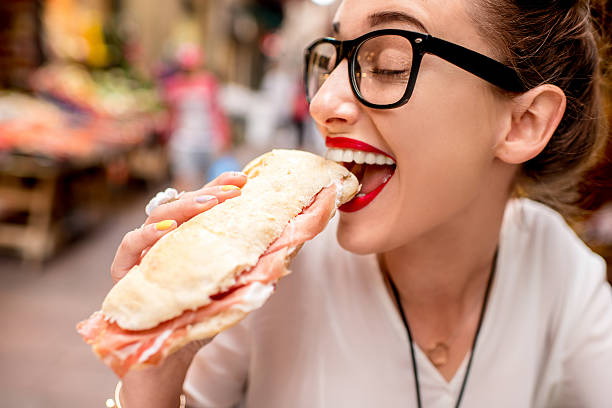 パニニと女性 - sandwich food meat ham ストックフォトと画像